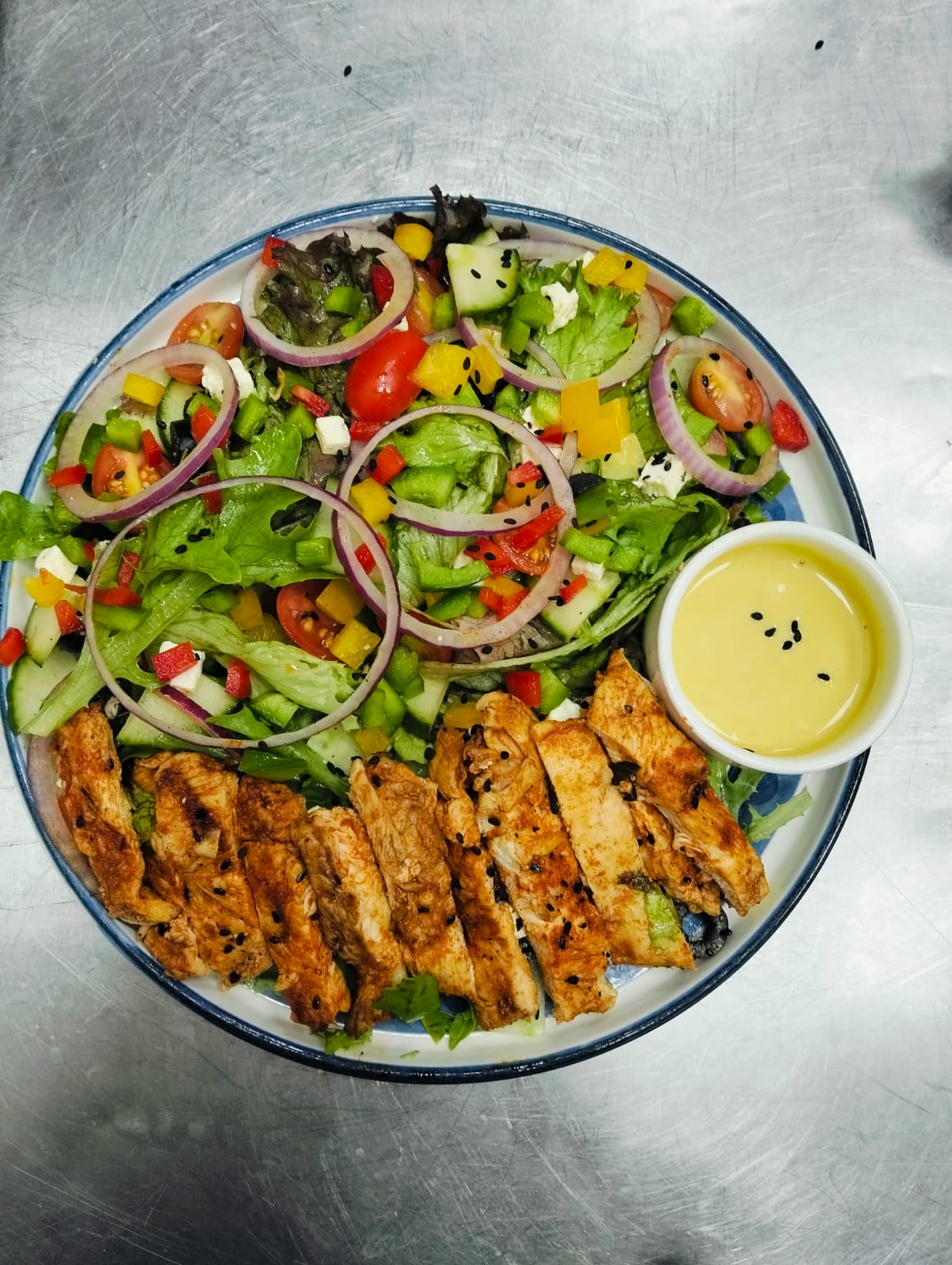 Grilled chicken Greek salad with honey mustard dressing
