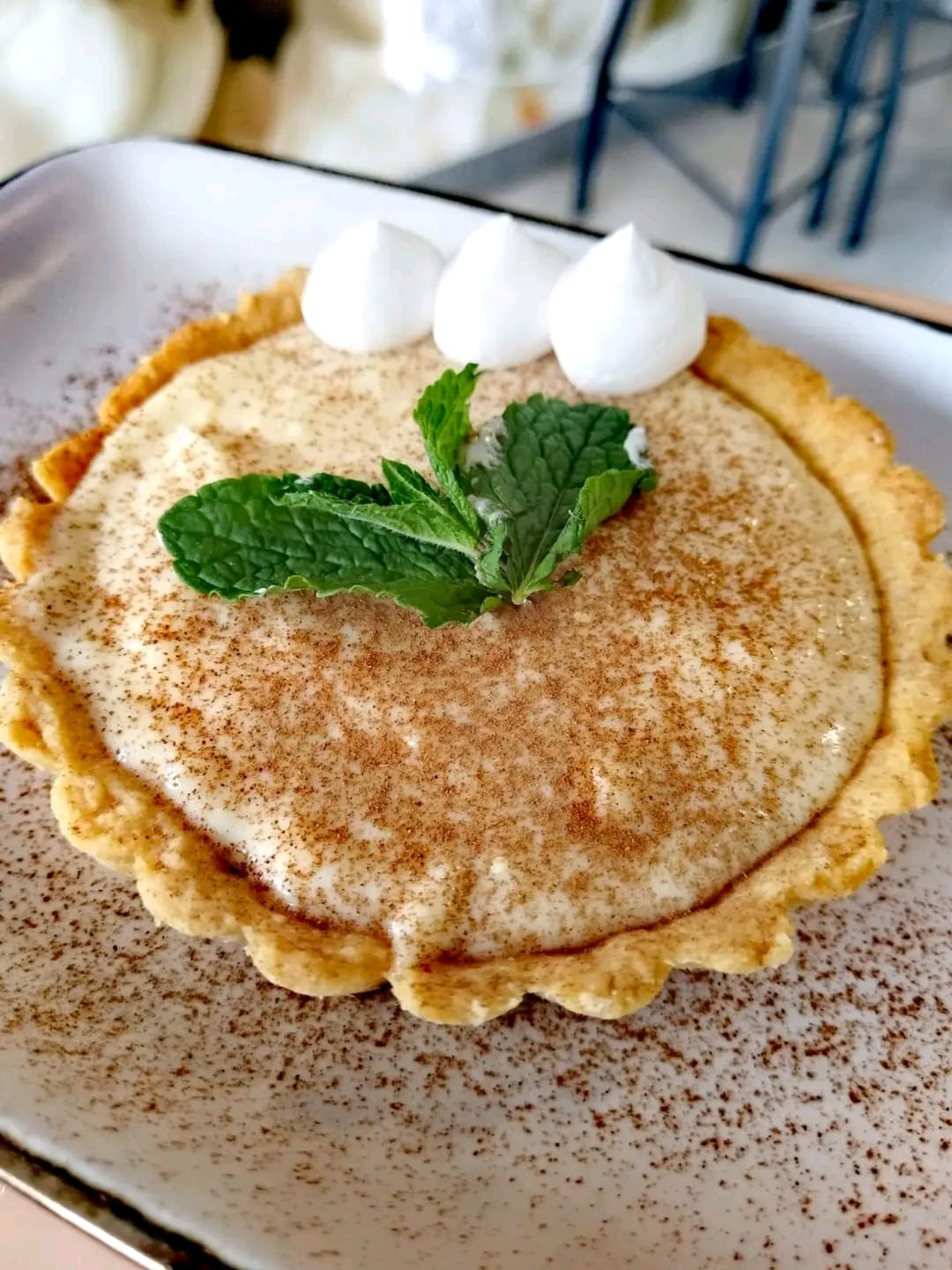 South African milk tart with cream meringue and cinnamon