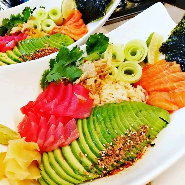 Sashimi poke bowl with tuna, salmon, avocado and seaweed